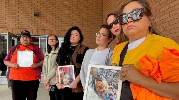 Image shows family and friends of Brandi Keenatch and Natalie Gardipy outside Saskatoon Provincial Court. (Stacey Hein/CTV News)

