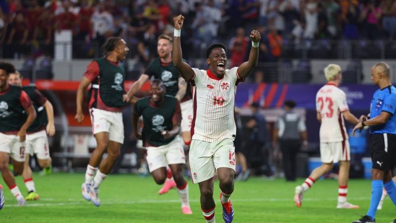 Canada forward Jonathan David (10) celebrates the team's win over Venezuela in a Copa America quarterfinal soccer match in Arlington, Texas, Friday, July 5, 2024. (AP Photo/Richard Rodriguez)