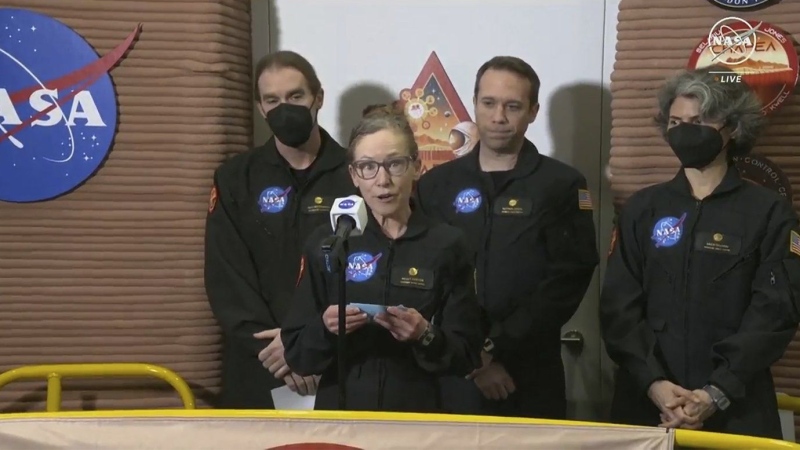 In this image made from video provided by NASA, Kelly Haston, the crew members of the first CHAPEA mission, speaks in front of other members, from left to right, Ross Brockwell, Nathan Jones, and Anca Selariu, Saturday, July 6, 2024, at Johnson Space Center in Houston, Texas.(NASA via AP)