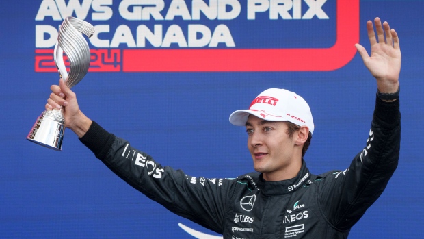 Mercedes driver George Russell of the United Kingdom celebrates his third place finish at the Canadian Grand Prix Formula 1 car race, in Montreal, Sunday, June 9, 2024. THE CANADIAN PRESS/Paul Chiasson