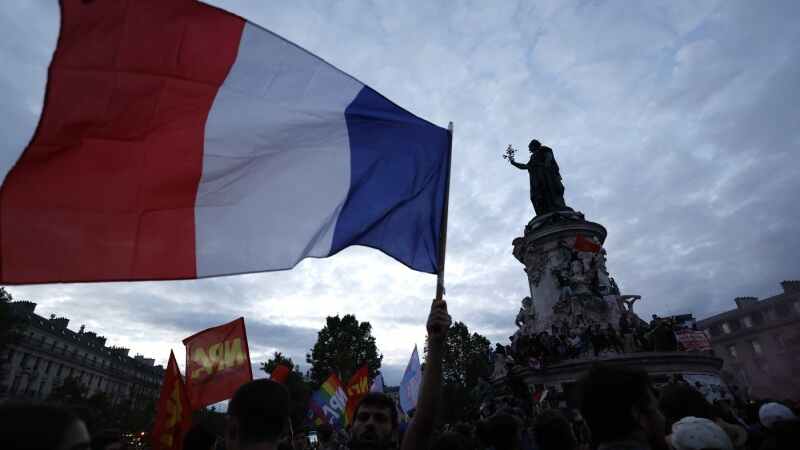 People gather on the Republique plaza following the second round of the legislative elections, Sunday, July 7, 2024 in Paris. (Aurelien Morissard/AP Photo)