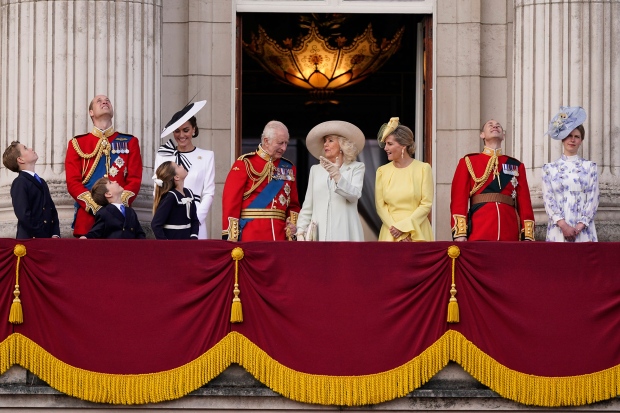 King Charles III, at centre with Queen Camilla, third right, joined by Prince George, left, Prince William, Prince Louis, Princess Charlotte, Catherine Princess of Wales, Sophie Duchess of Edinburgh, third right Prince Edward and Lady Louise Windsor on the Balcony at Buckingham Palace after attending the Trooping the Colour ceremony, in London, Saturday, June 15, 2024. (AP Photo/Alberto Pezzali)

